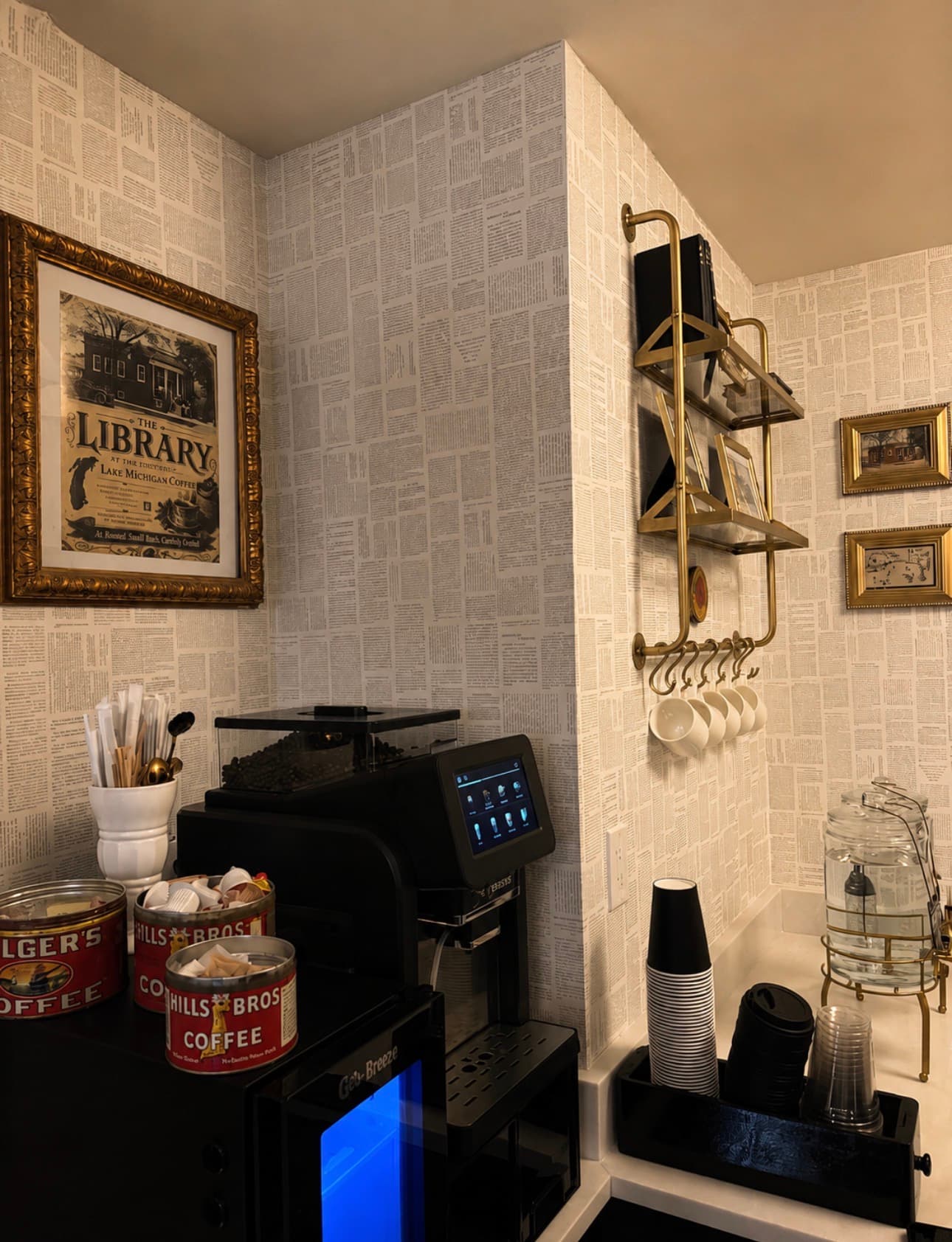 Bean-to-cup coffee machine, chilled drink fridge, and vintage coffee tins in the Archive Lounge