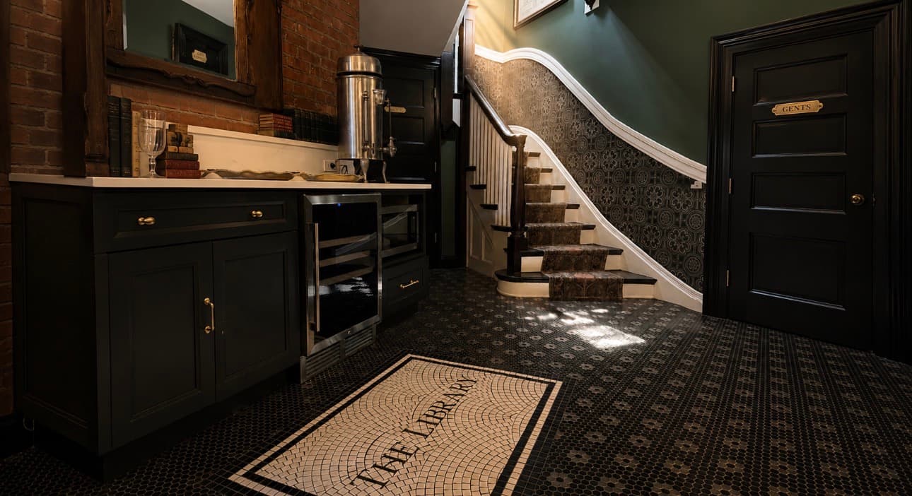 The Library Historic Hotel — downstairs breakfast lobby with fresh pastries, infused water, and craft coffee